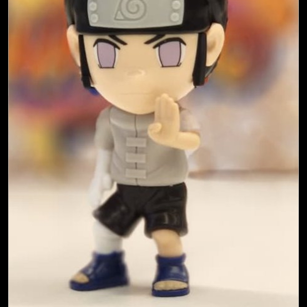 Anime Character Figurine with Black and Blue Outfit